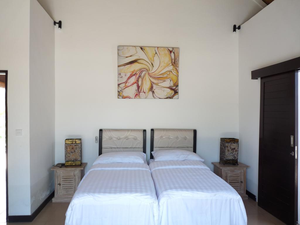 Taman Dewi Sri Villa Et Bungalow Pemuteran Habitación foto